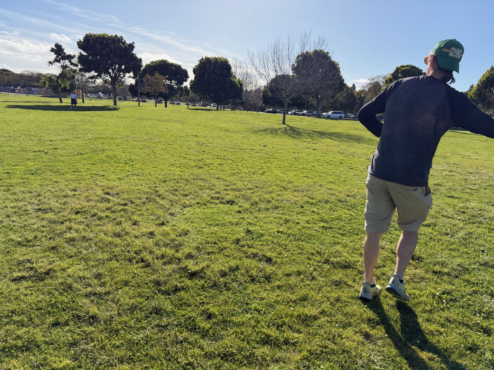 Alan mid-throw on a grassy field, training regimen