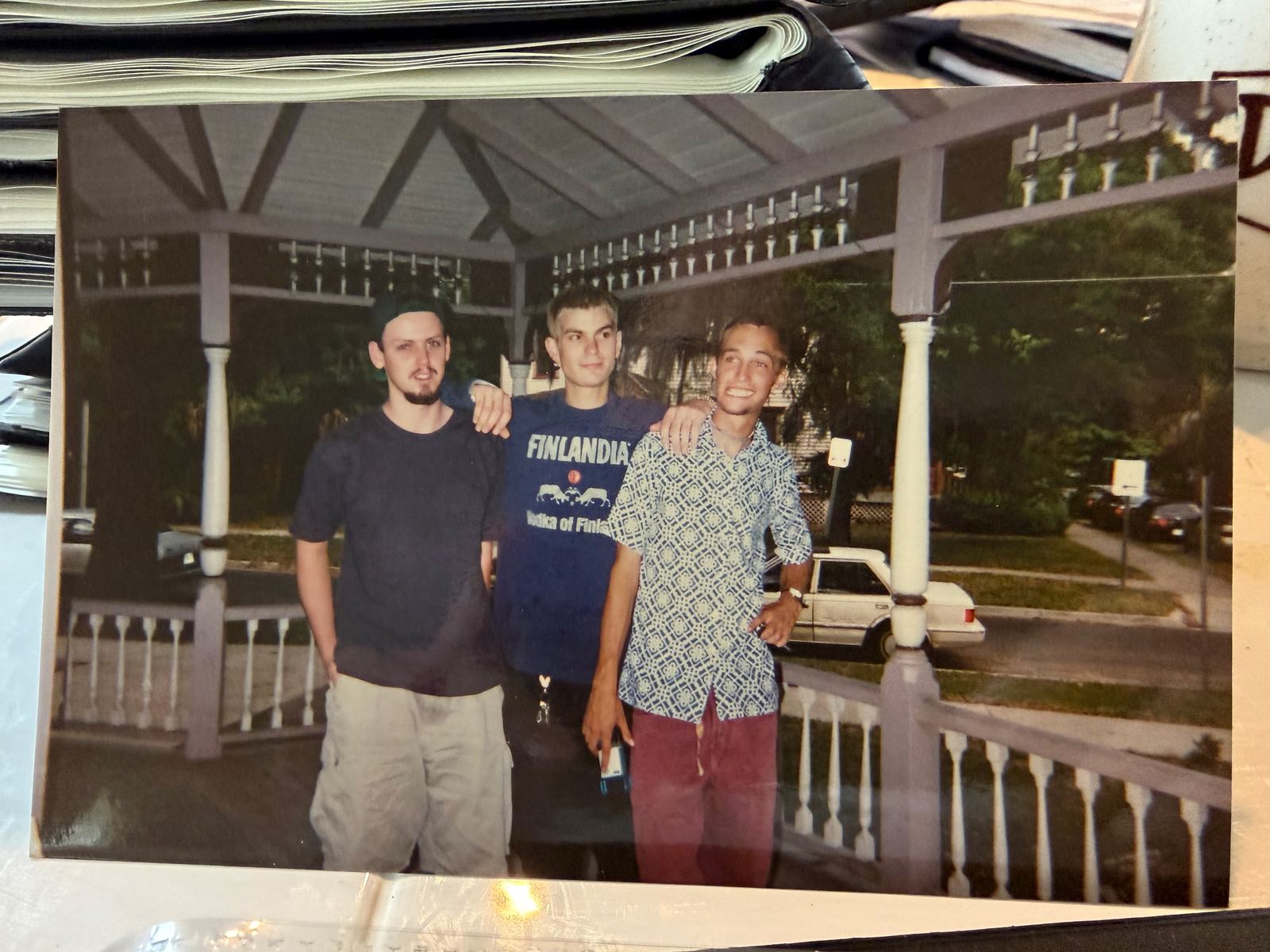 Young Alan and two friends on a porch